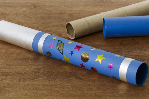 A plain cardboard tube, cardstock and a completed toy DIY telescope