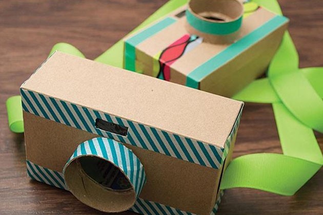 Small cardboard boxes decorated with patterned washi tape