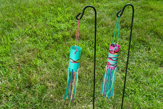 Mini windsocks made from cardboard tubes and yarn.