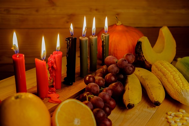 Decorative candles with a variety of fresh foods
