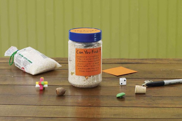 Jar of rice with objects hidden inside for kids to find and count.