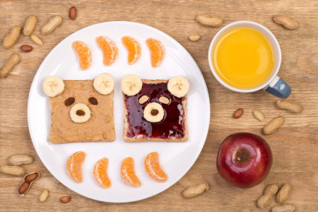 Bear faces made with peanut butter and jelly on bread