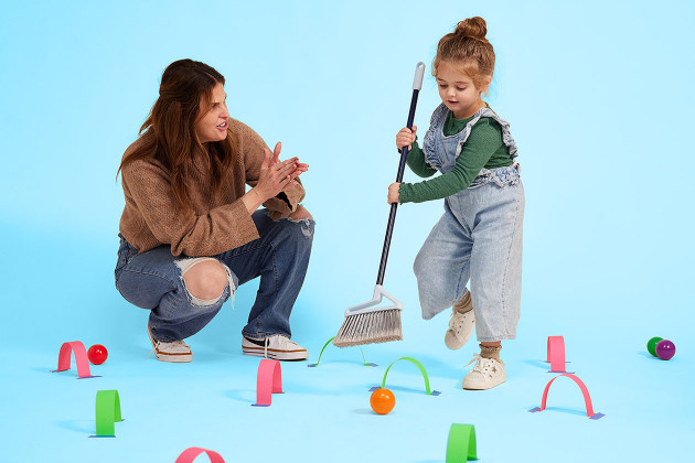 adult and kid playing an indoor DIY game