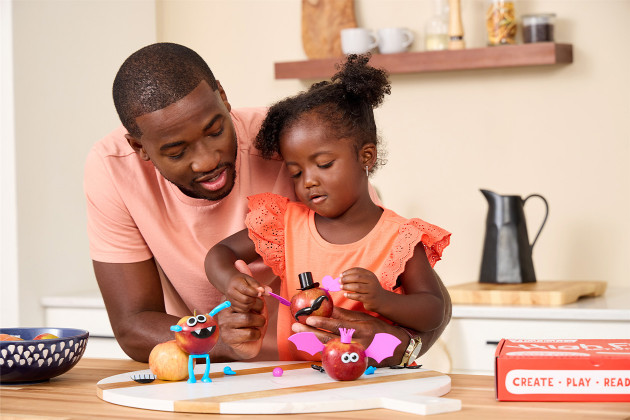 An adult and child crafting together