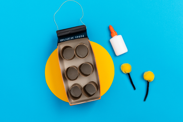 bug hotel craft featuring glue and cardboard circles 