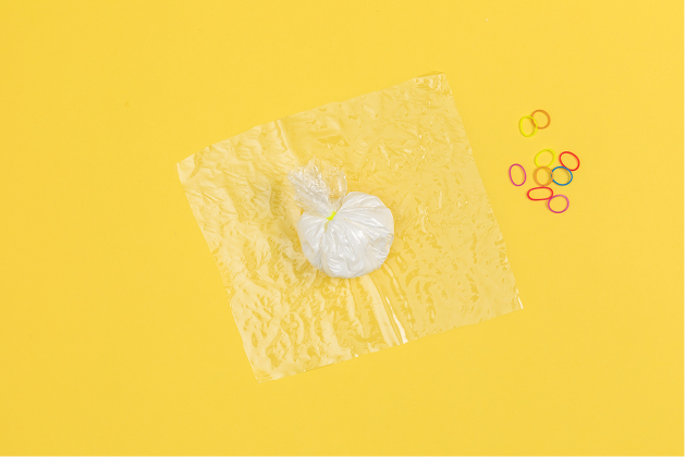 squish buddies craft step 2 featuring cornstarch wrapped in plastic
