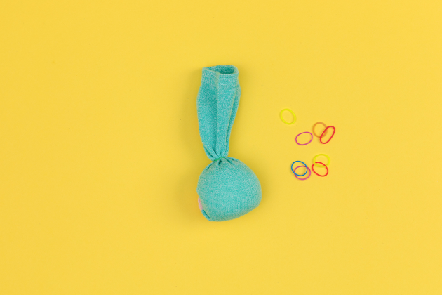 squish buddies craft step 3 with cornstarch packet in sock