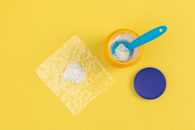squish buddies craft step 1 featuring cornstarch on plastic