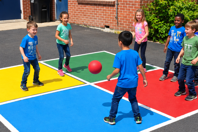kids playing four square 
