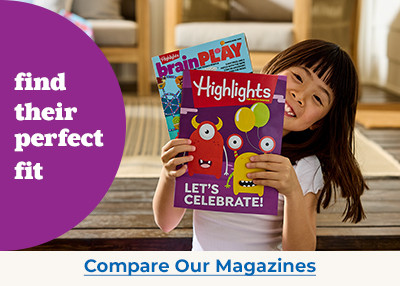 Little kid holding magazines in hand.