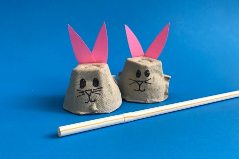 Two bunny faces made from egg carton cups.
