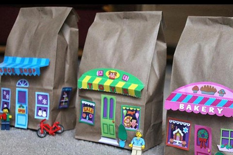Paper bags with printed shop fronts glued to them.