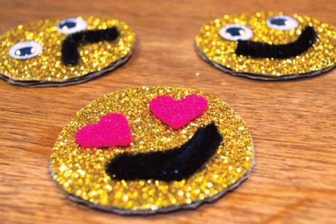 Smiling emoticons made with glitter.