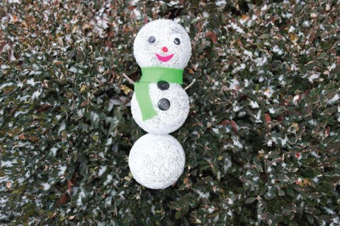 Homemade snowman made with glitter.