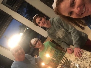 Robin Saks Frankel and her family celebrating Hanukkah together.
